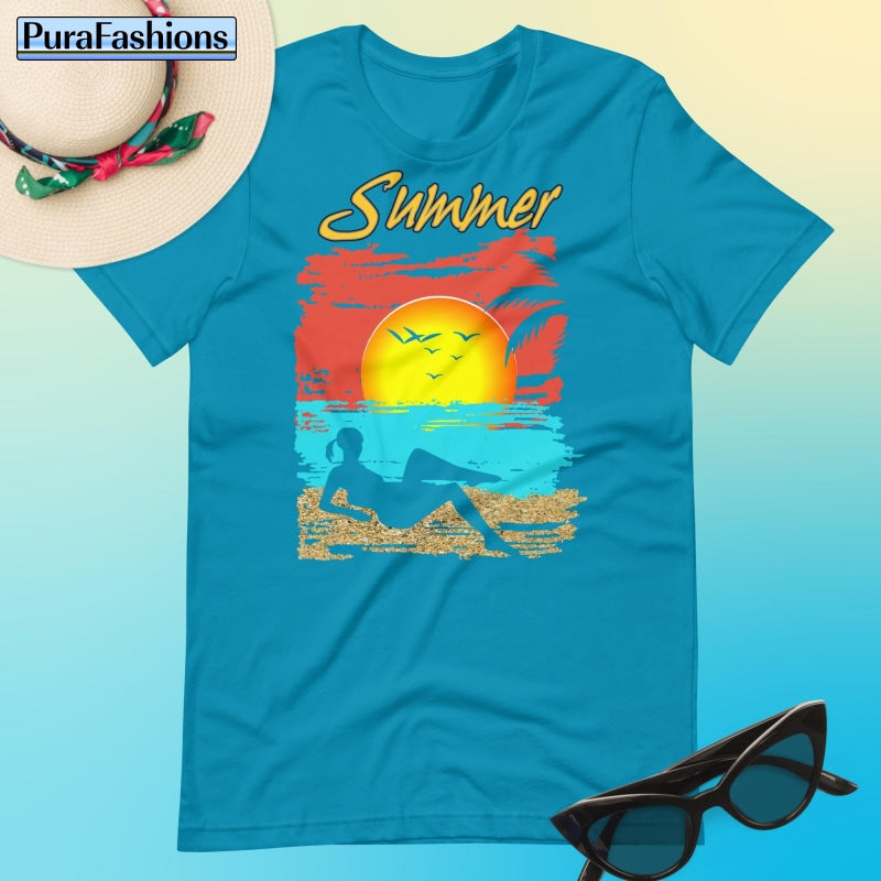"Dive into summer style with our refreshing aqua T-shirt adorned with a tropical beach design and the word 'Summer' in bold letters. Feel the vacation vibes wherever you go. Available now at PuraFashions.com."