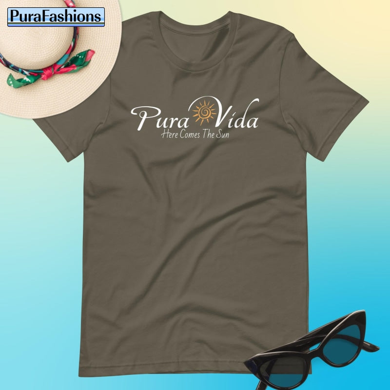 "Channel the essence of tranquility in our earthy army green T-shirt, adorned with the mantra 'Pura Vida' and a sun graphic, promising brighter days ahead. Find your perfect blend of style and positivity at PuraFashions.com."
