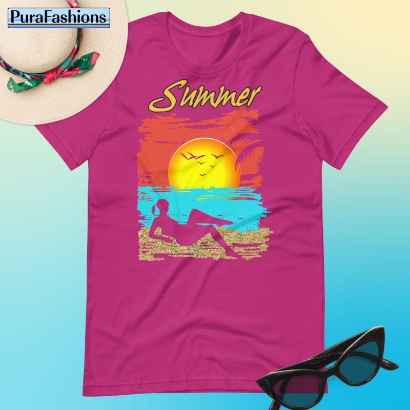 "Infuse your summer wardrobe with vibrant energy in our enticing berry red T-shirt adorned with a tropical beach design and the word 'Summer' in bold. Dive into relaxation with style. Available now at PuraFashions.com."