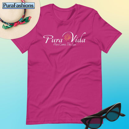 "Capture the essence of joy in our captivating berry red T-shirt, featuring the uplifting mantra 'Pura Vida' and a radiant sun graphic. Embrace positivity with every wear! Available now at PuraFashions.com."