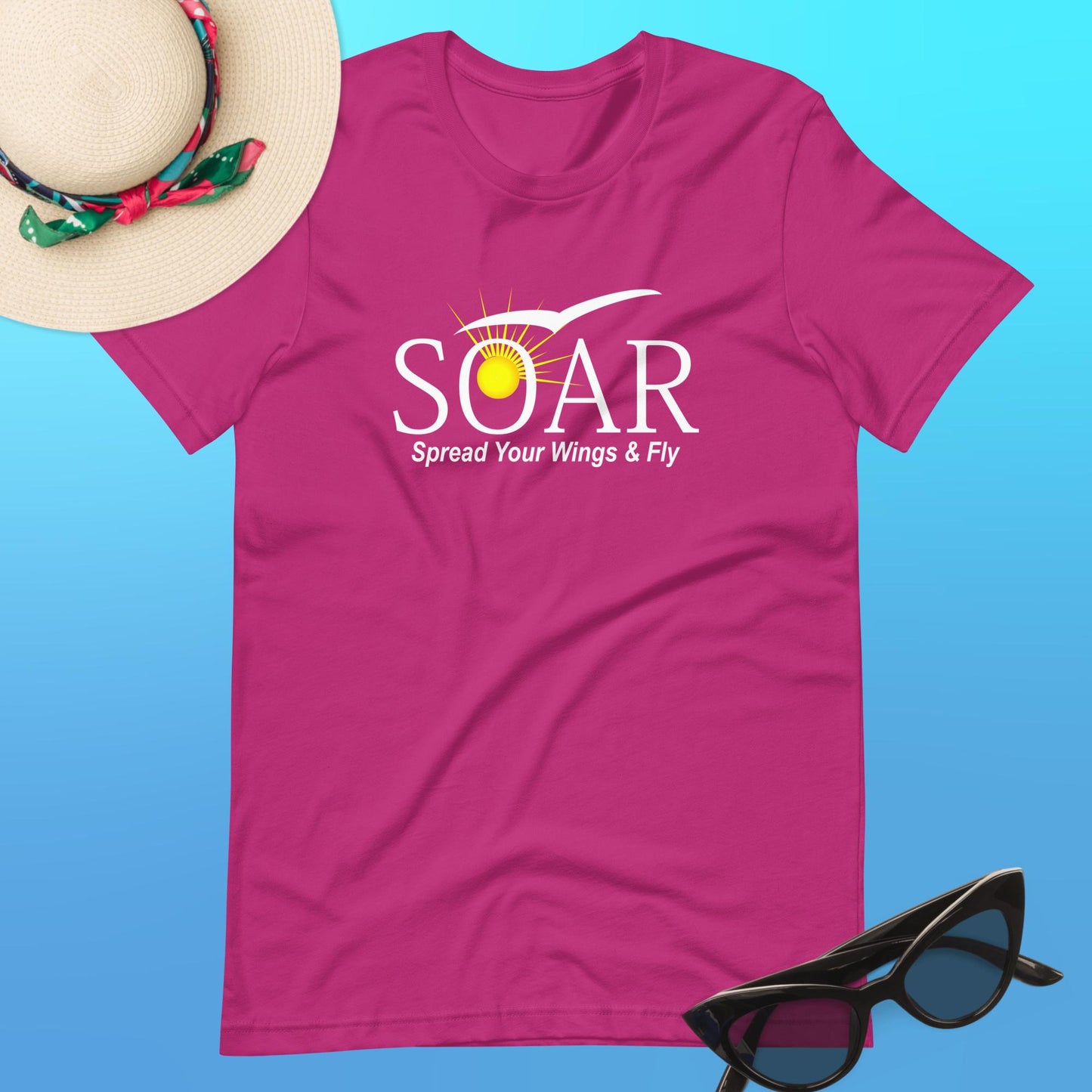 "Berry Red T-Shirt with 'SOAR' Graphic: Sun and Seagull Design Encouraging Flight. 'Spread your wings & fly' - Available at PuraFashions.com. Flat-lay image showcasing the front design."