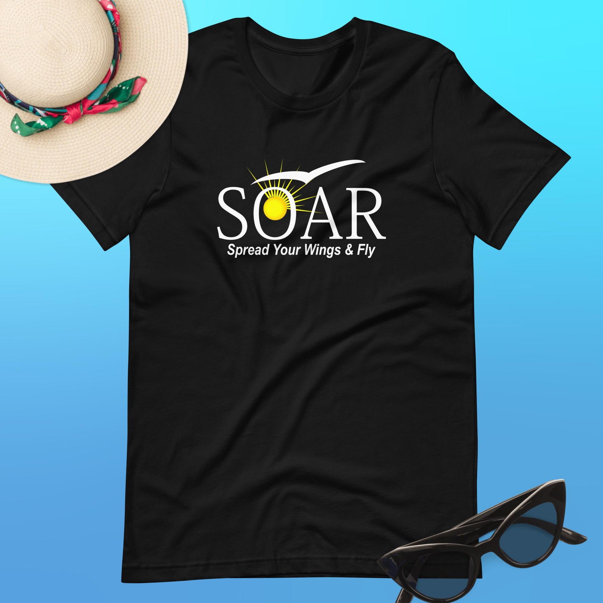 "Classic Black T-Shirt: 'SOAR' Design with Sun and Seagull Motif. 'Spread your wings & fly' - Available at PuraFashions.com. Flat-lay image showcasing the front design."