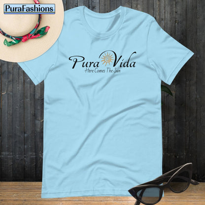 "Dive into tranquility with our mesmerizing ocean blue T-shirt, adorned with the empowering message 'Pura Vida' and a radiant sun graphic. Embrace the promise of brighter days ahead. Available now at PuraFashions.com."