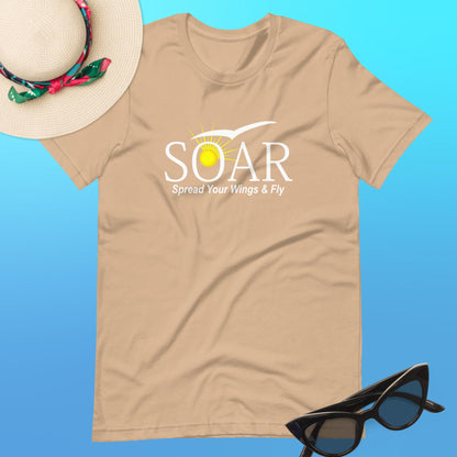 "Tan T-Shirt with 'SOAR' Graphic: Sun and Seagull Design, Inspiring Flight. 'Spread your wings & fly' - Available at PuraFashions.com. Flat-lay image showcasing the front design."