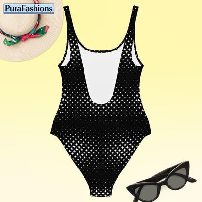 "Chic simplicity: PuraFashions.com unveils the back view of a black one-piece swimsuit with a delicate white star pattern, laid flat to highlight its understated elegance and stylish design."