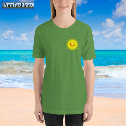 "Front view of a woman wearing a leaf green T-shirt with a small happy face sun and a few stars on the chest. The T-shirt also features a large happy face sun, stars, and the text 'You're My Sunshine' on the back. Available at PuraFashions.com."