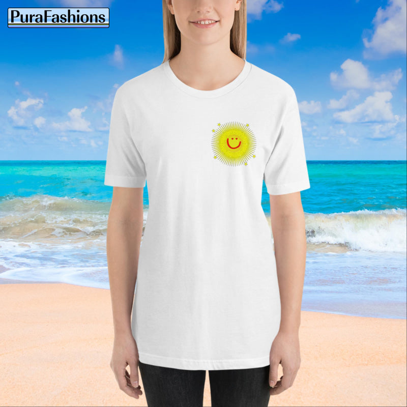 "Front view of a woman wearing an white T-shirt with a small happy face sun and a few stars on the chest. The T-shirt also features a large happy face sun, stars, and the text 'You're My Sunshine' on the back. Available at PuraFashions.com."