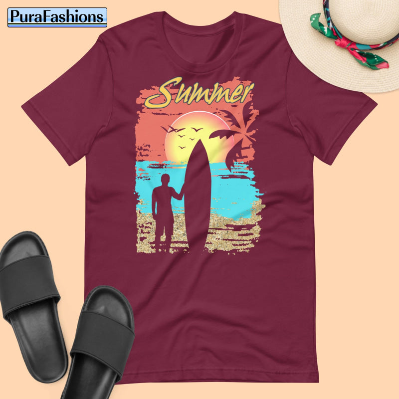 "Add a touch of warmth to your summer wardrobe with our maroon tee! Featuring the word 'Summer' in bold lettering, set against a picturesque tropical beach scene and accented with the silhouette of a laid-back surfer holding a surfboard. This relaxed yet stylish design is perfect for sunny days ahead. Available now at PuraFashions.com. Don't miss out!"