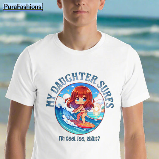Man wearing a white T-shirt featuring a design of a girl riding a wave on a surfboard. Above the design, the text reads 'My Daughter Surfs', and below it, the text reads 'I'm Cool Too, Right?'. Available at PuraFashions.com. For Men and Women.