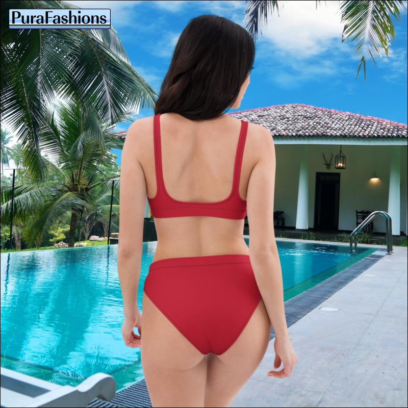 "Poolside glamour: A woman stands confidently by the pool, showcasing the alluring back view of a red high waist bikini from PuraFashions.com, exuding timeless charm and vibrant sophistication against the backdrop of the shimmering water."