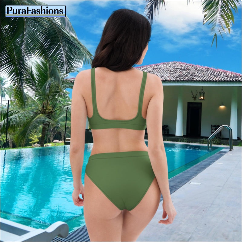 "Poolside elegance: Standing by the pool, a woman showcases the chic fern green high waist bikini from PuraFashions.com, capturing attention with its stylish design and flattering silhouette in this back view shot against the tranquil pool backdrop."