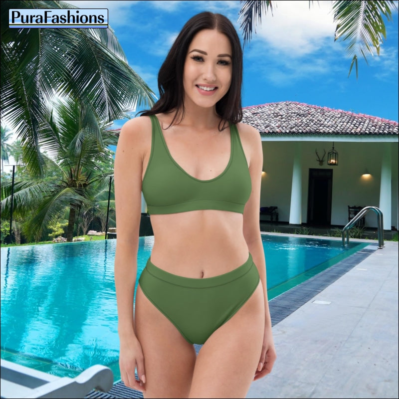"Poolside charm: A woman stands confidently by the swimming pool, donning a stunning fern green high waist bikini from PuraFashions.com, exuding elegance and sophistication against the serene blue waters."