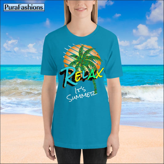 Woman wearing an aqua T-shirt with a vibrant tropical design and the text 'RELAX It's Summer'. Available at PuraFashions.com."